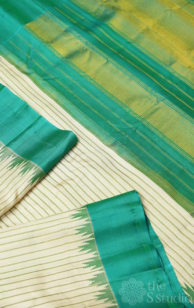 Off white gadwal silk saree with teal green temple border