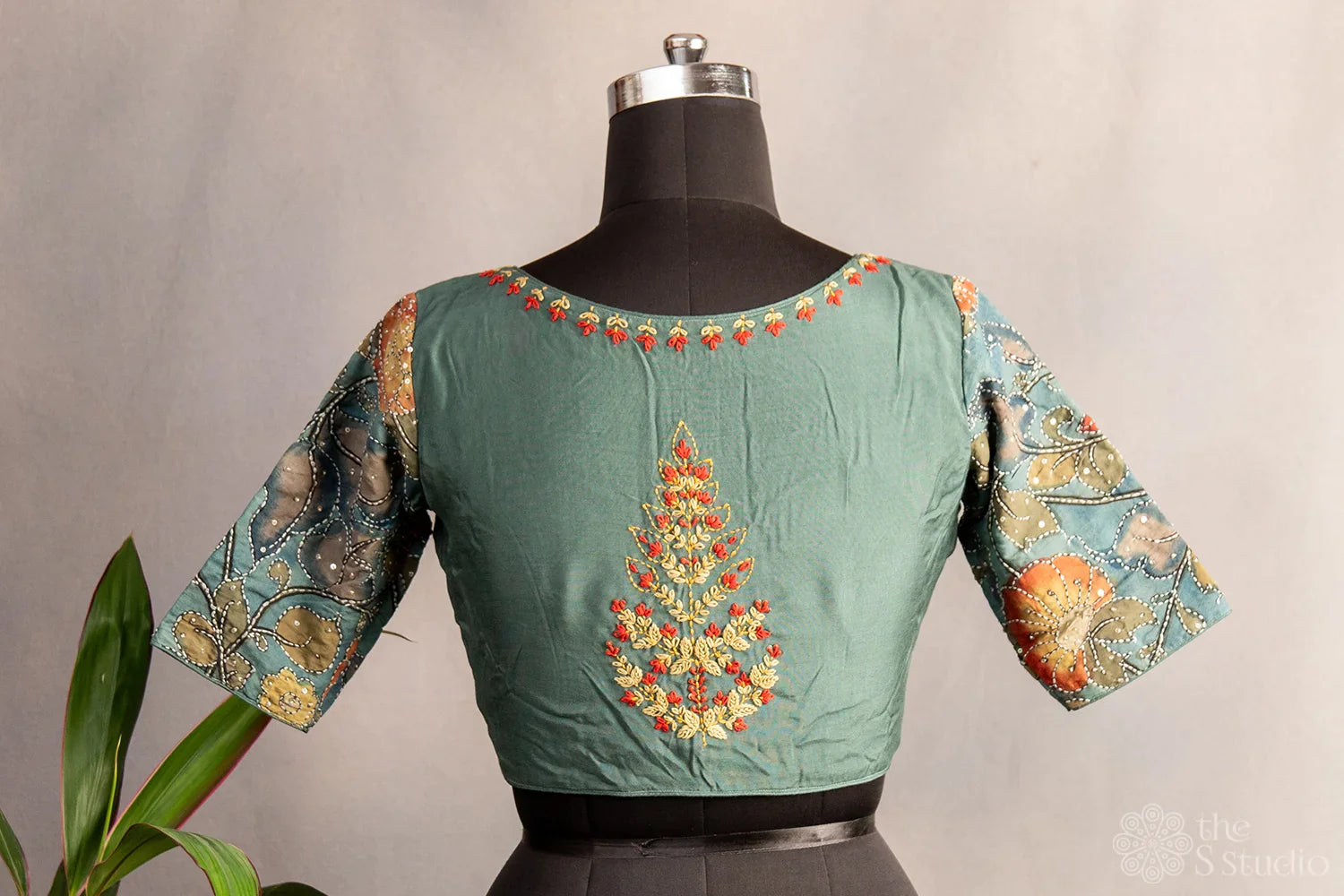 Pastel green embroidered silk blouse with kalamkari hand painted sleeves