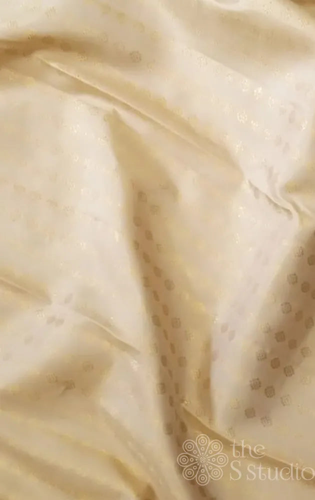 Beige kanchi silk blouse material with small zari buttas