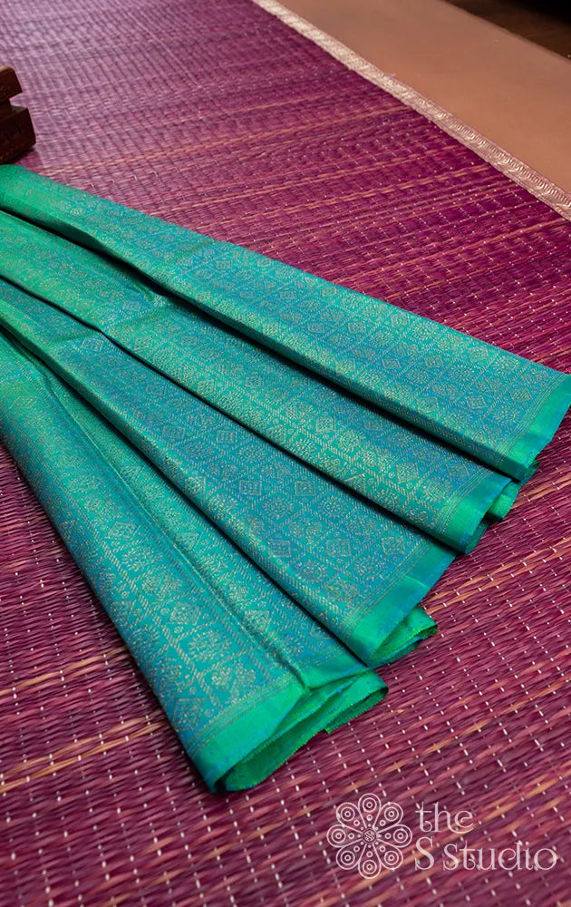 Sea blue kanchi silk blouse material with mayil chakaram motifs