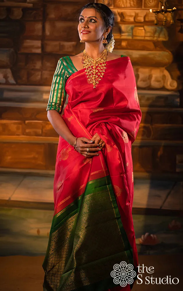 Red kanchipuram silk saree with green pallu