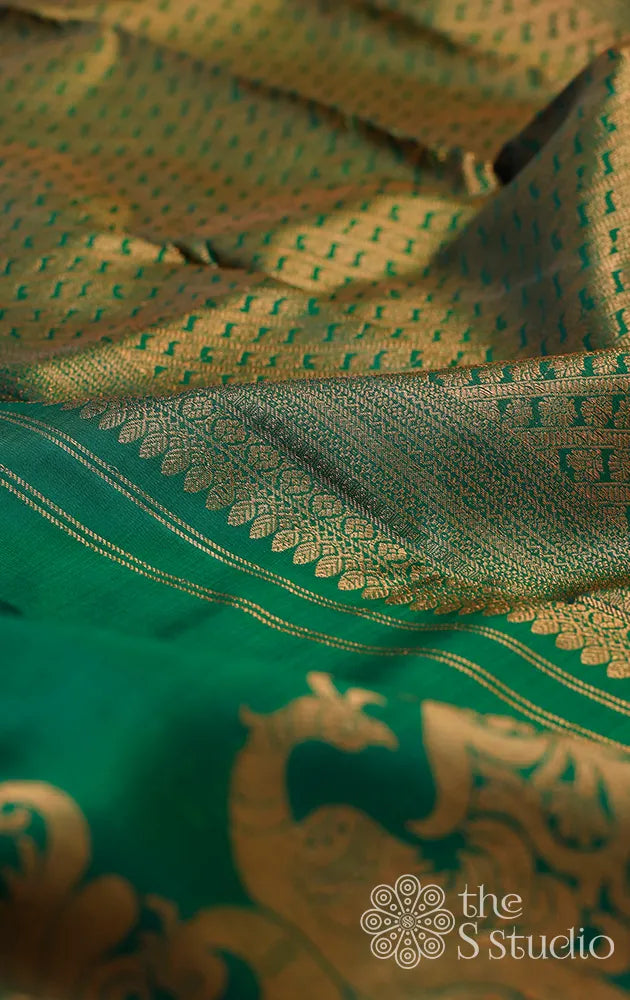 Green kanchipuram saree with antique zari border