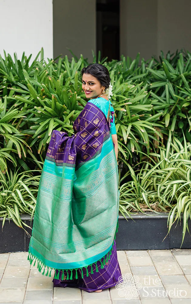Aubergine colour kanchi pattu saree with checks and buttas