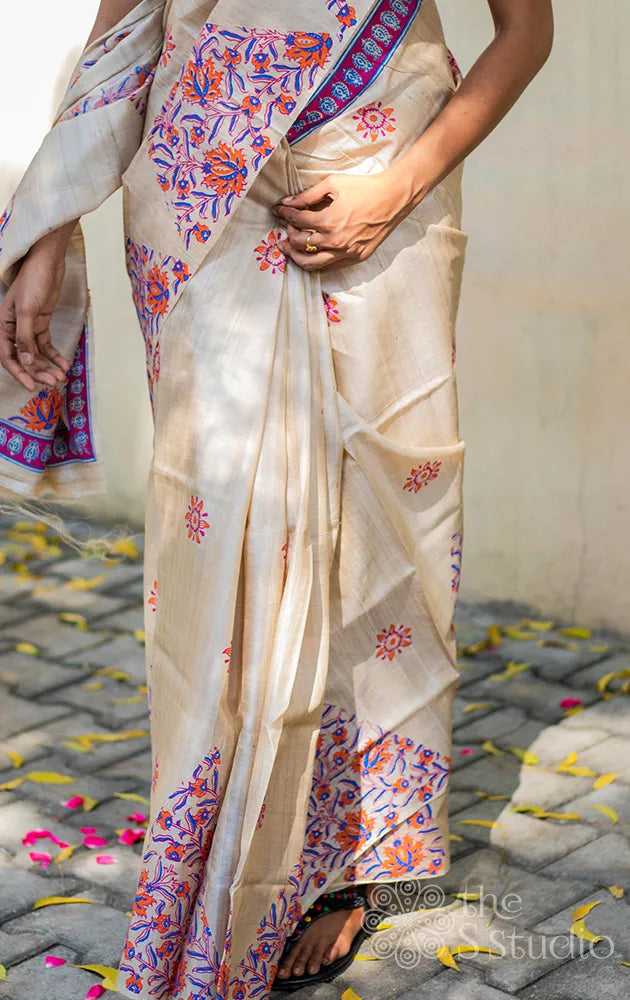 Cream tussar saree with geometric hand block print border