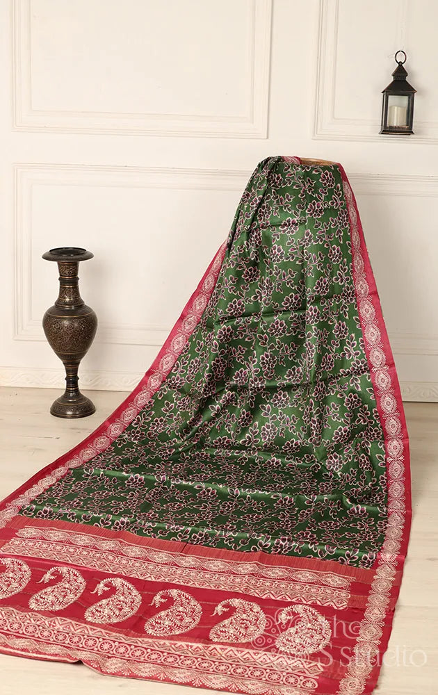 green tussar printed saree with embroidered border