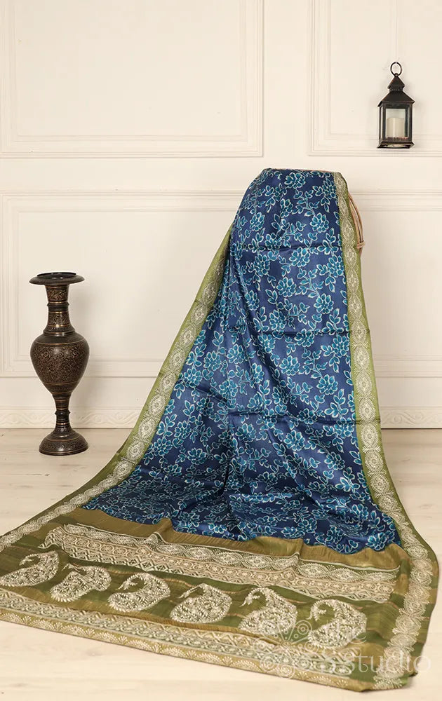 Blue tussar printed saree with embroidered border