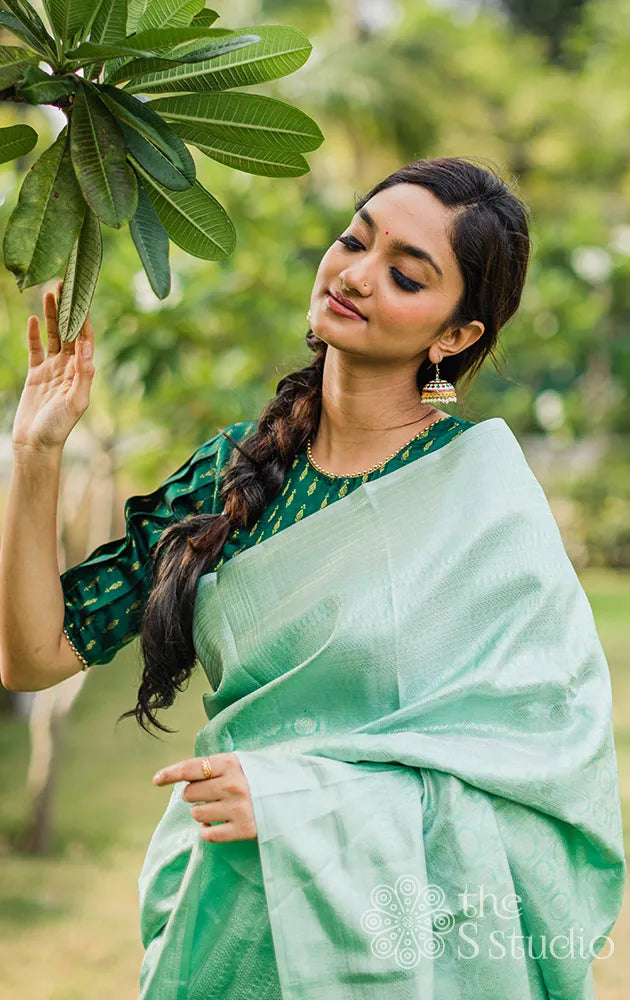 Pastel green kanchi silk saree with silver zari