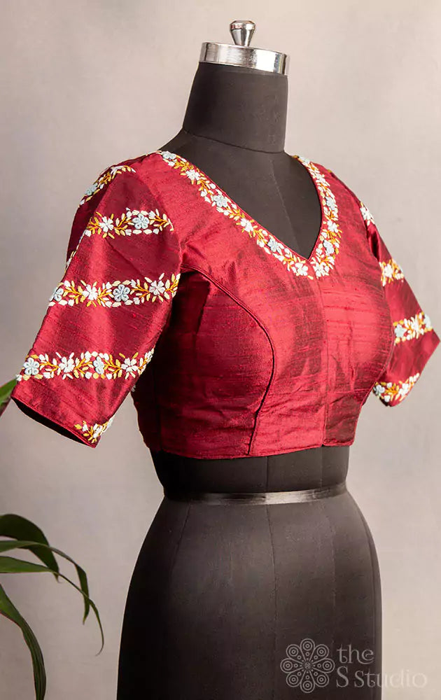 Maroon hand  embroidered raw silk blouse with rounded v neck pattern