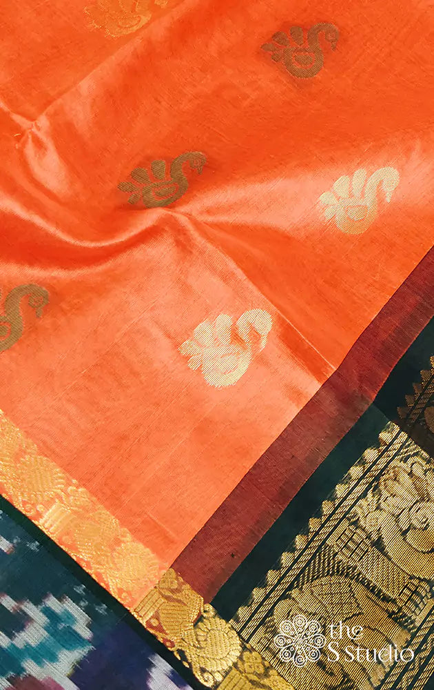 Bright orange silk cotton saree with forest green ikat border