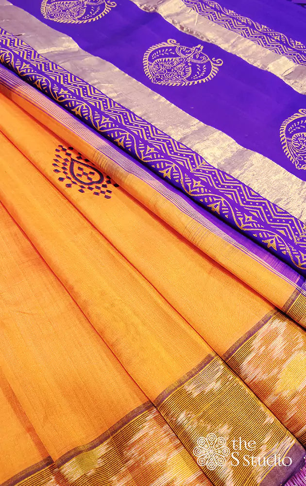 Orange silk cotton saree with ikat border