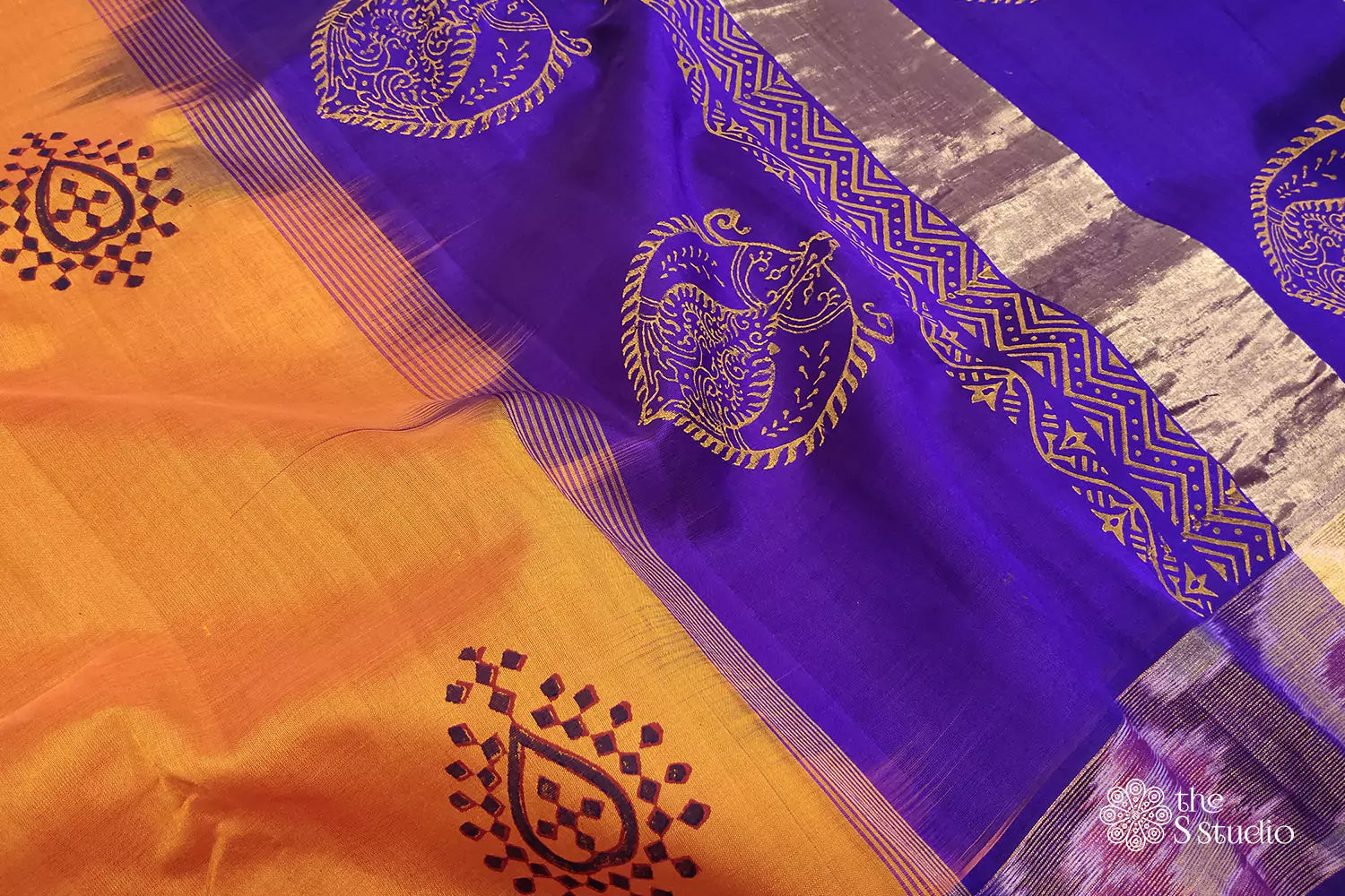 Orange silk cotton saree with ikat border