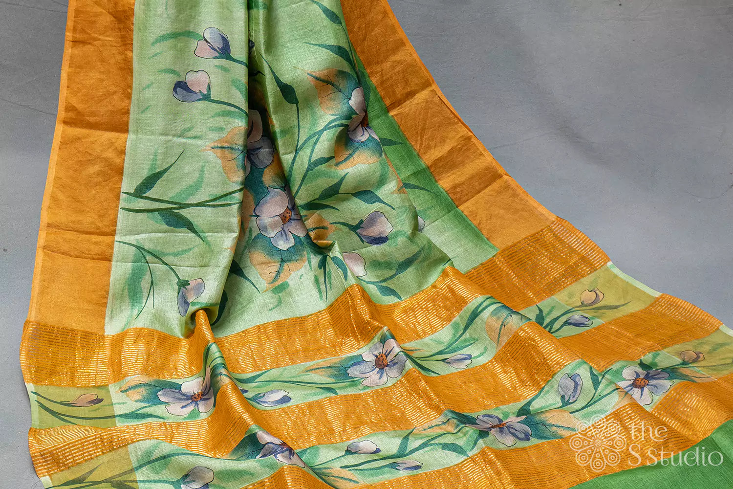 Green printed tussar saree with zari border