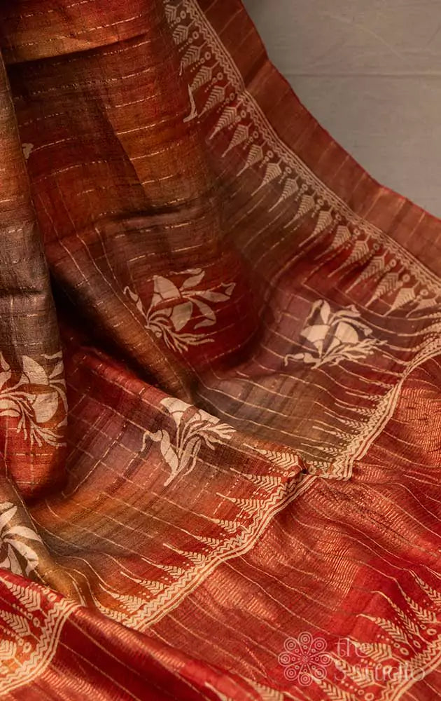 Rust zari checked tussar saree with floral prints