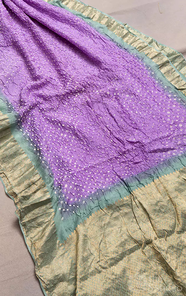 Lavender bandhej saree with banarasi border and sage green pallu