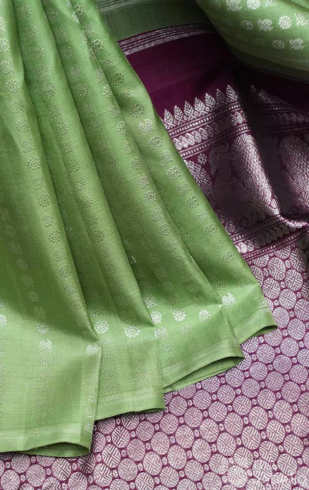 Elachi green kanchi pattu saree with silver zari lines