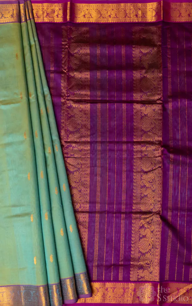 Pale green silk cotton saree with purple pallu