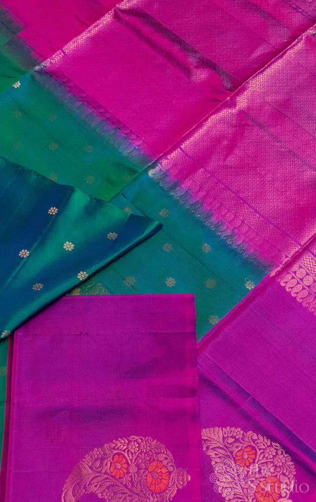 Bluish green soft silk saree with purple border and paisley motifs