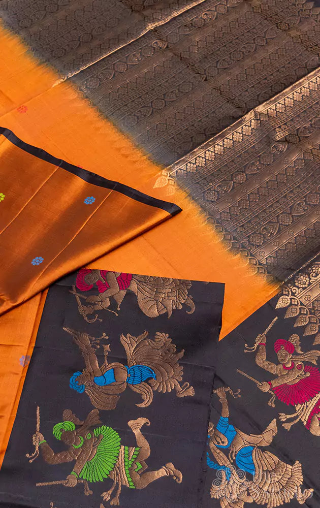 Golden mustard soft silk saree with black border woven with dancers motifs