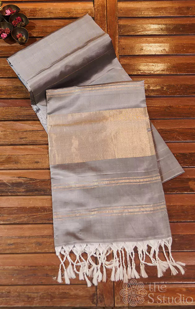 Grey plain soft silk saree with zari pallu