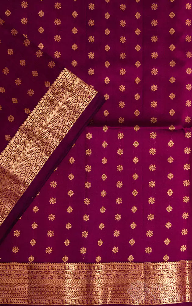 Purple small border soft silk saree with small buttas all over