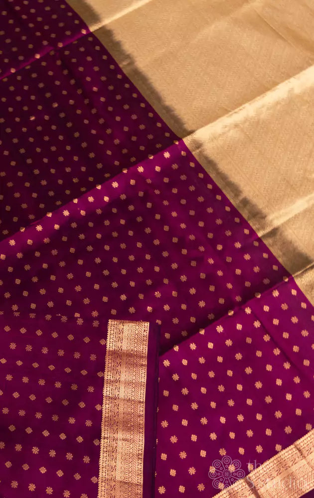 Purple small border soft silk saree with small buttas all over