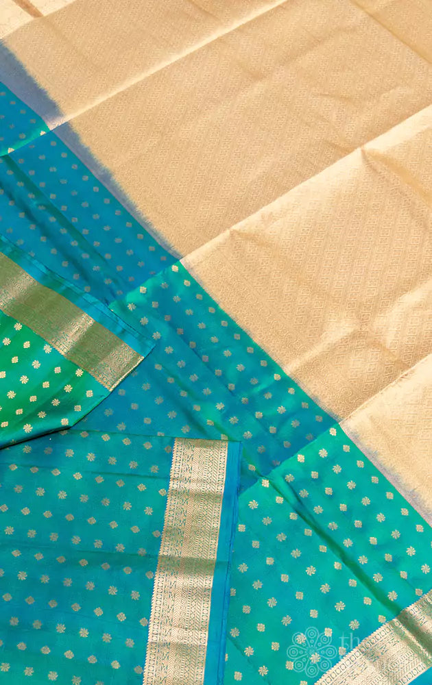 Greenish blue small border soft silk saree with small buttas all over
