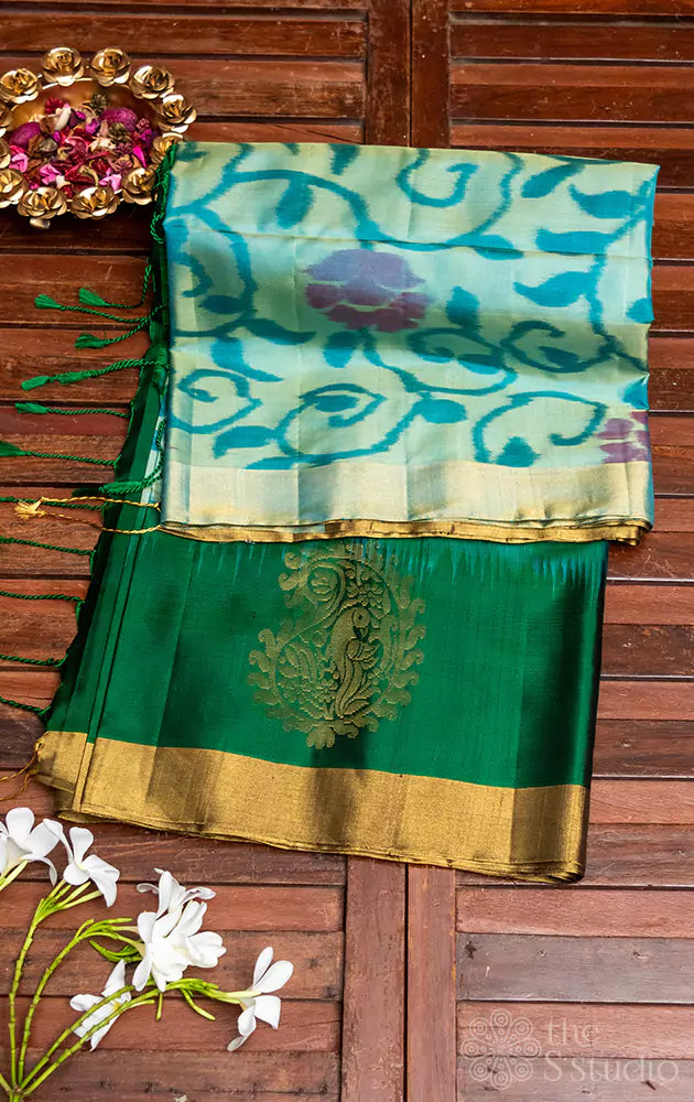 Sky blue ikat soft silk saree with contrast green border and pallu