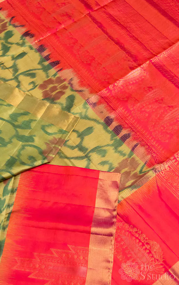 Pastel green soft silk ikkat saree with orangish pink pallu