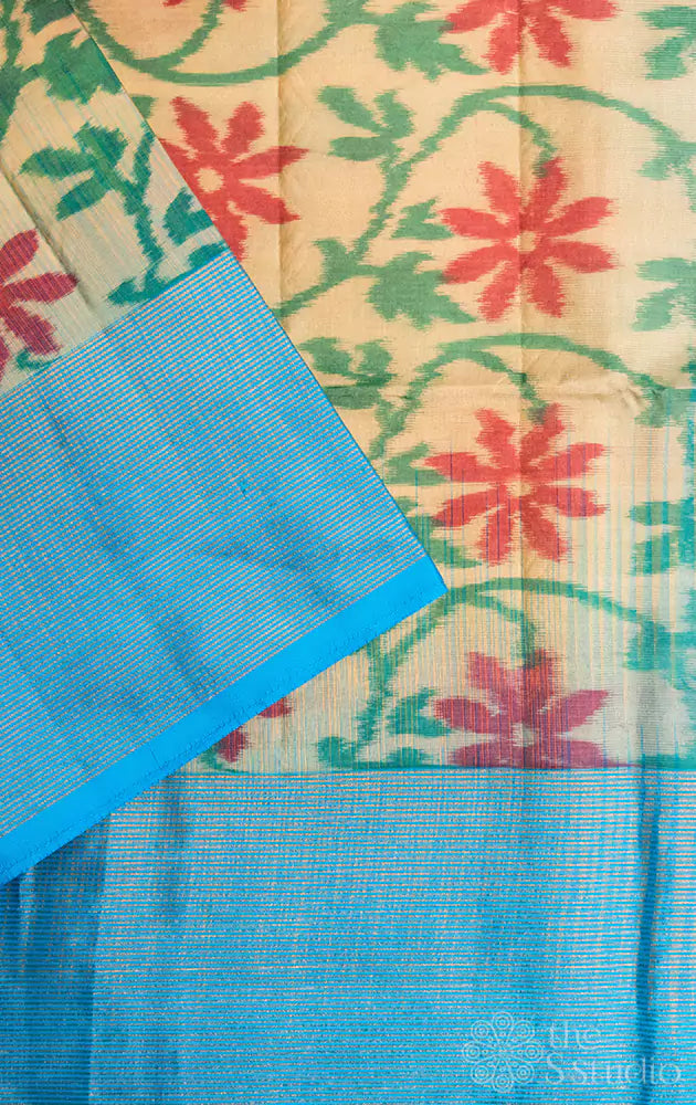 Light elachi green ikat soft silk saree with light blue zari lined border