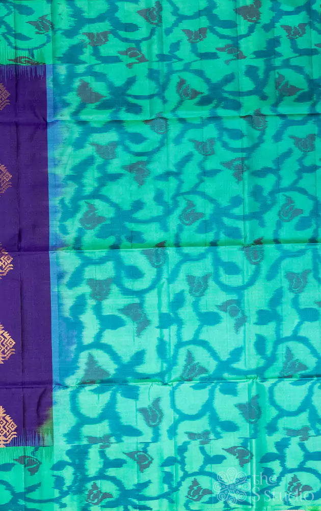 Deep violet soft silk saree with aqua blue ikat design woven border