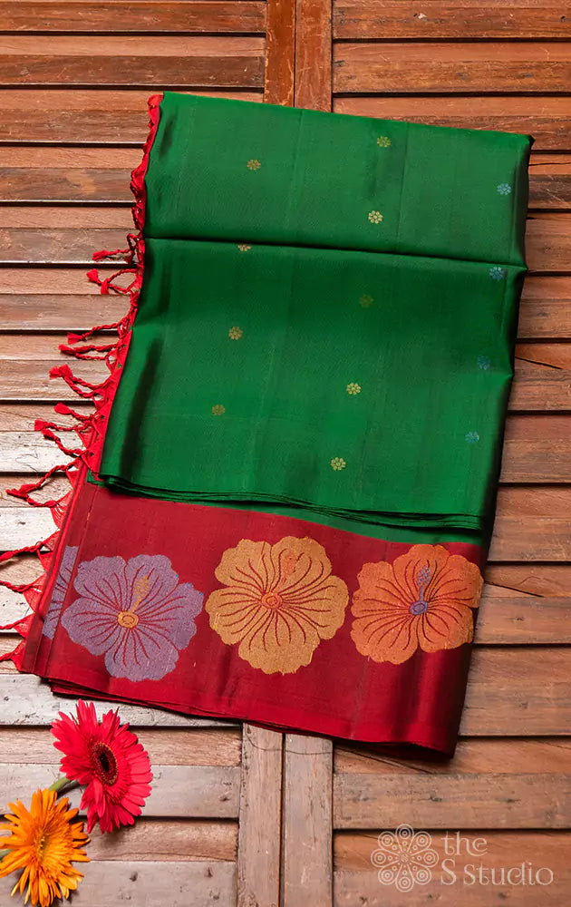 Green soft silk saree with contrast red border woven with floral motifs