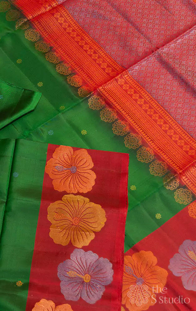Green soft silk saree with contrast red border woven with floral motifs