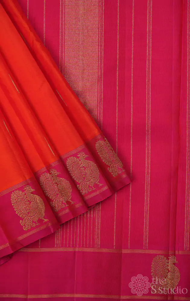 Orange kanchi silk saree with peacock motifs