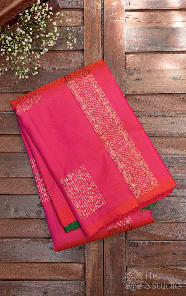 Peachish orange pink kanchi silk saree with green pallu