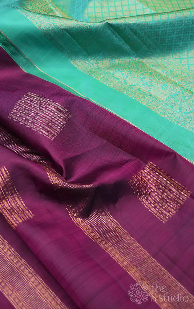 Plum coloured kanchi silk saree with aqua blue pallu