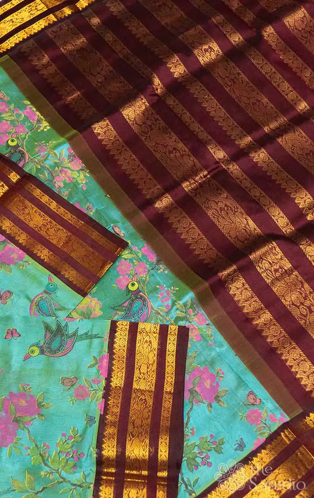 Sea green silk cotton saree with block print and brown border