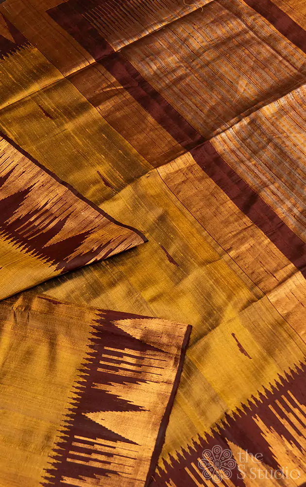 Golden methi green raw silk saree with contrast brown and gold temple border