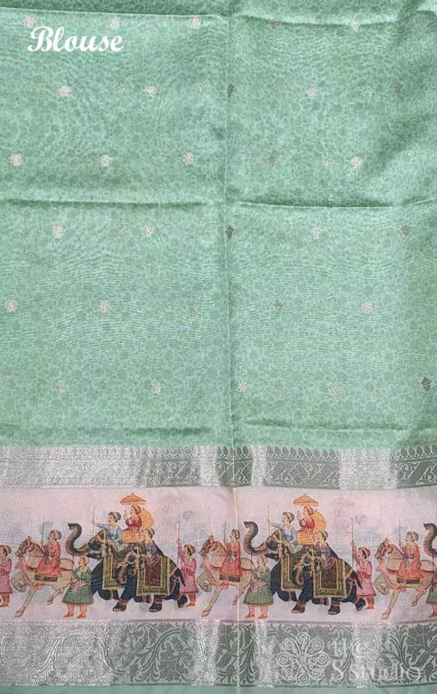 Light green printed saree with elephant border