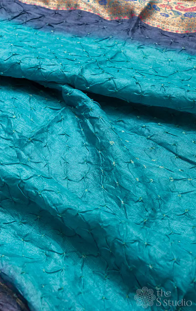 Light blue bandhani saree with navy blue border and a brocade pallu
