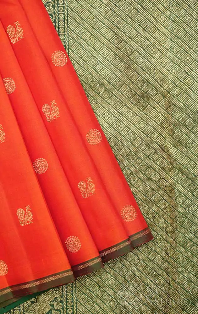 Orange kanjivaram saree  with peacock buttas