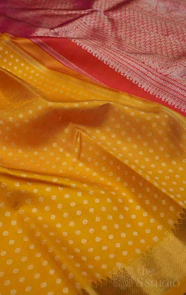 Mango yellow kanchi silk saree with silver buttas
