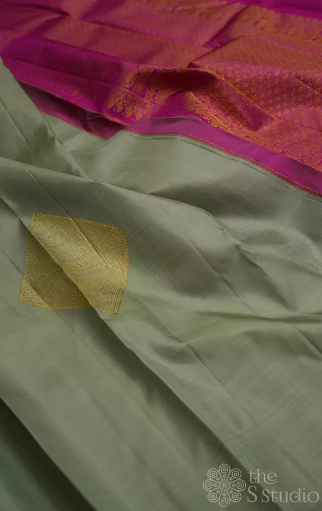 Elachi green kanchi silk sarees with diamond woven zari buttas