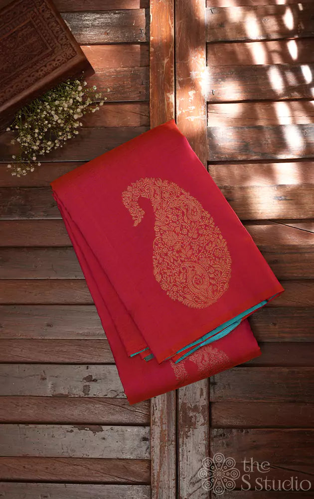 Peach kanchipuram silk saree with woven paisley zari motifs
