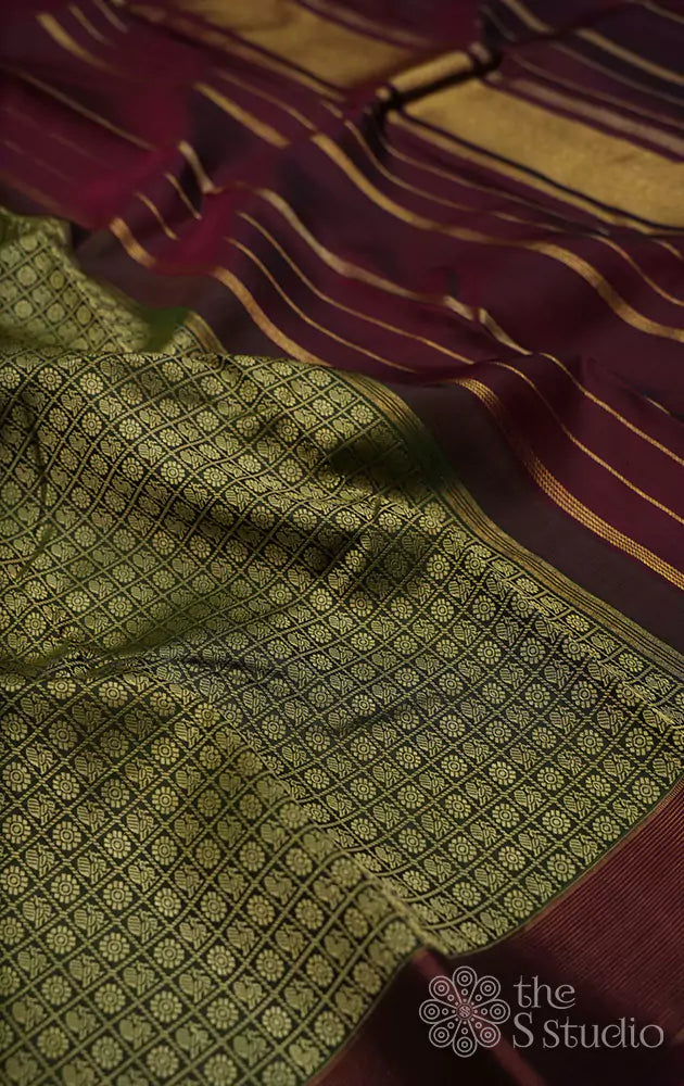 Methi green kanchi silk saree with mayil chakaram buttas and a magenta small border