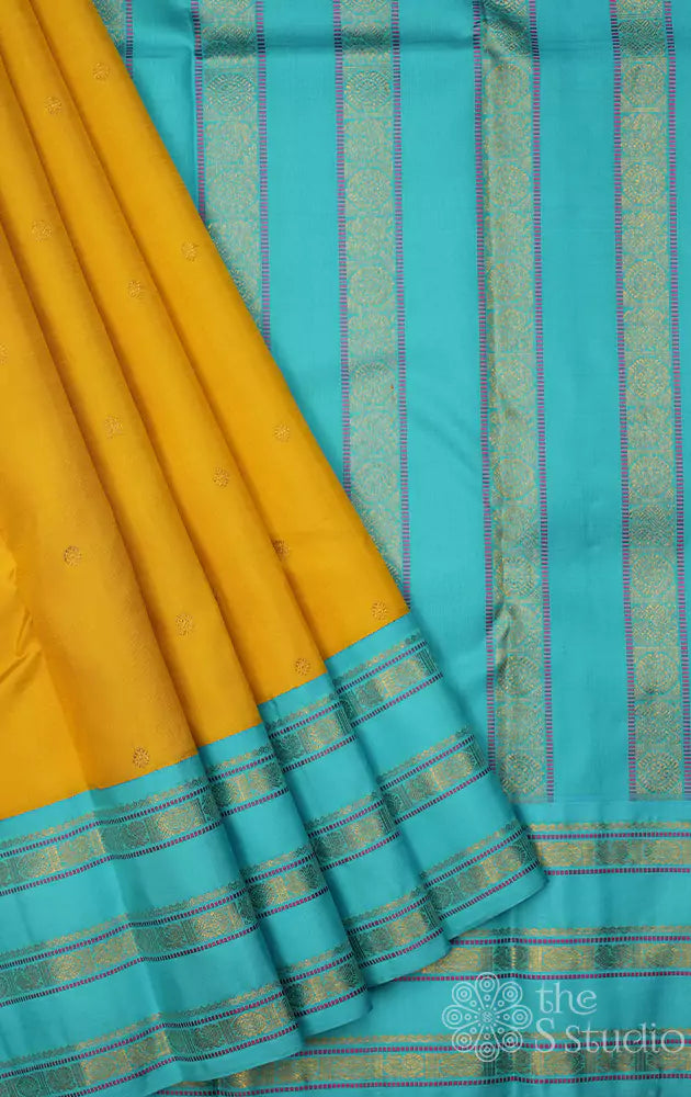 Yellow kanchi silk saree with light blue border