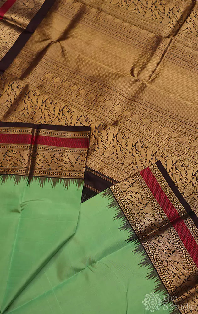 Parrot green kanchi silk saree with korvai brown border