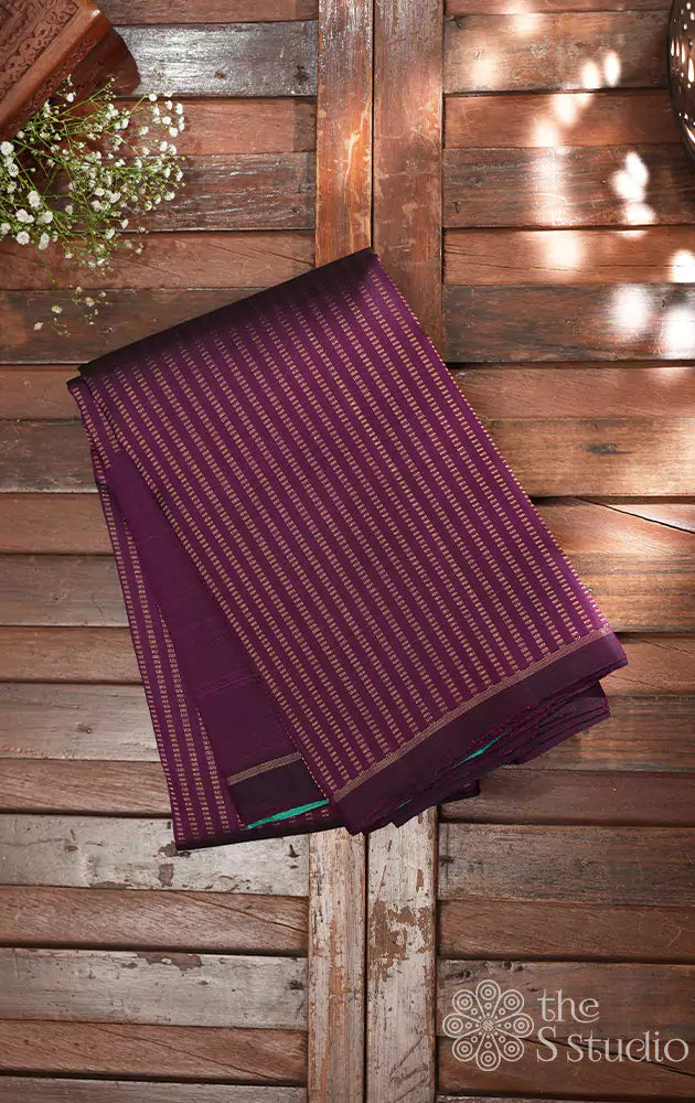 Purple kanjivaram saree with raising vertical zari patterns 