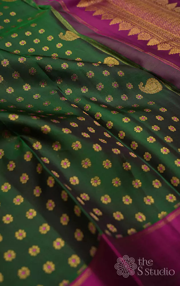 Green kanchi silk saree with meenakari buttas and magenta pallu