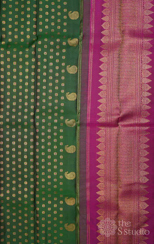 Green kanchi silk saree with meenakari buttas and magenta pallu