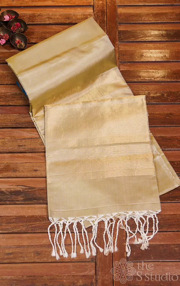 Beige plain soft silk saree with zari pallu